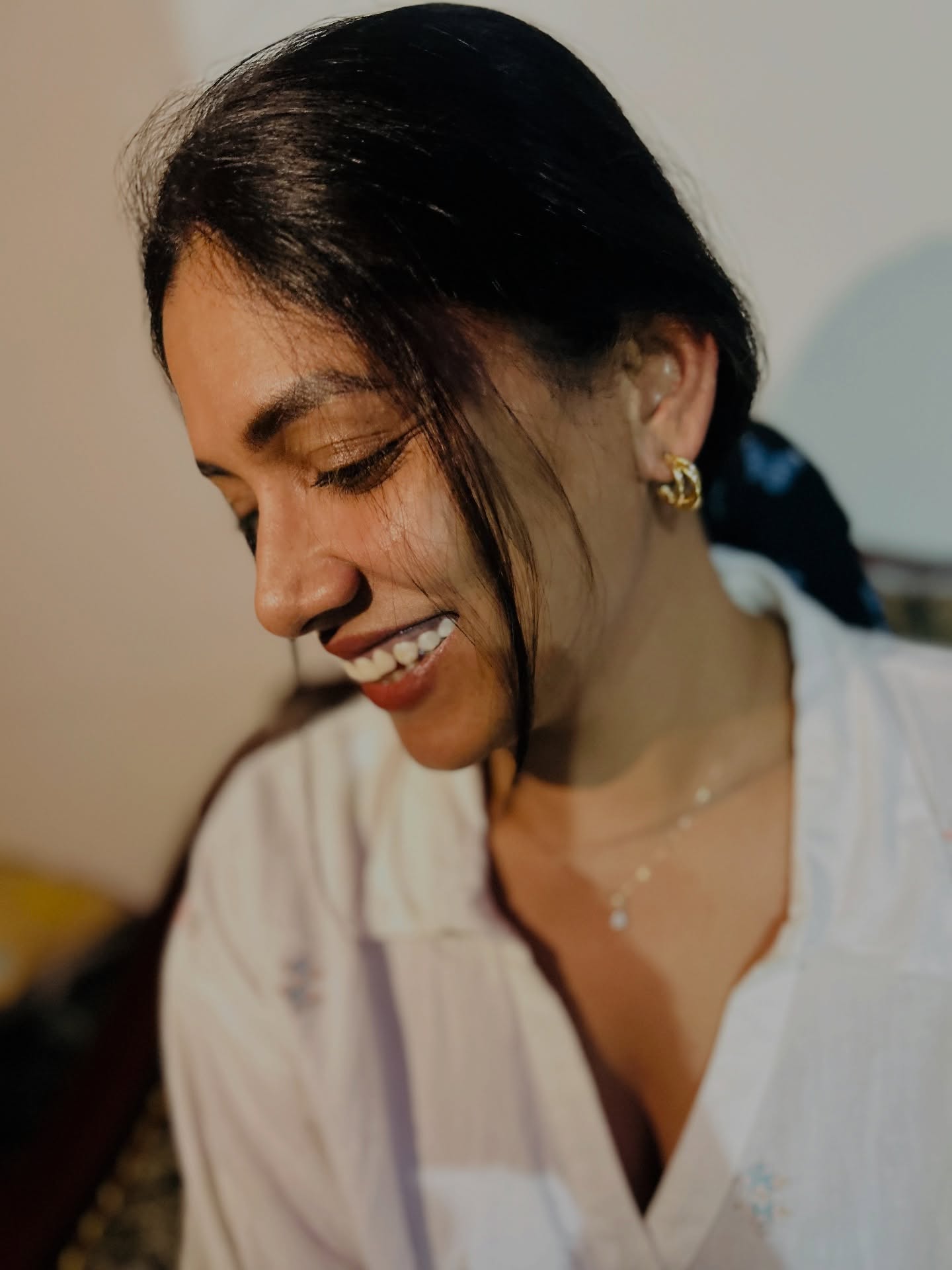 Sai Prasanna — white shirt, smiling